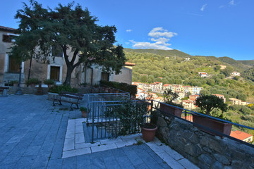 Fototapeta premium Pisciotta, Italy, 02/15/2020. A narrow street between the old houses of a medieval village in southern Italy