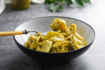 Cooked tortellini on a plate, close up pasta, italian food.