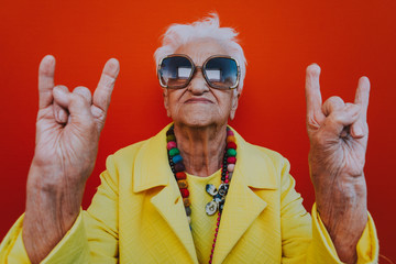 Funny grandmother portraits. Senior old woman dressing elegant for a special event. Rockstar granny...