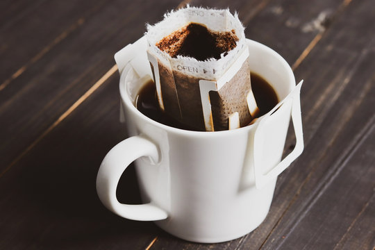Drip or brewed coffee on wooden table