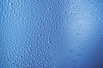  water drops on glass on a blue background1