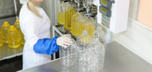 Sunflower oil factory. Factory line of production and filling of refined oil from sunflower seeds.