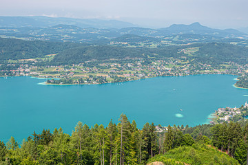 Panorama on a summer day. Landscape of Austria. Blue Lake, huge forests
