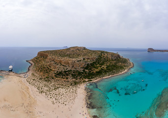 Amazing aerial panoramic view on the famous Balos beach in Balos lagoon and pirate island Gramvousa. Place of the confluence of three seas (Aegean, Adriatic, Libyan). Balos beach, Chania. Crete island
