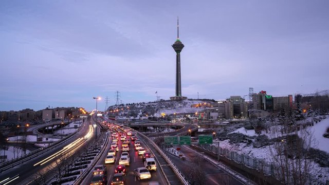 Sunrise of an Snowy morning, A View of an expressway in Tehran and Milad tower. 