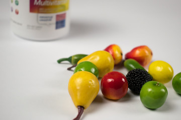 white bottle vitamins closeup table background closeup fruits vegetables healthy lifestyle