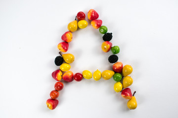 eat vitamins letter clsoeup fruits vegetables represent symbol health happy life