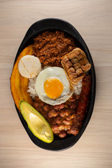 Try paisa, colombian typical food on wood background