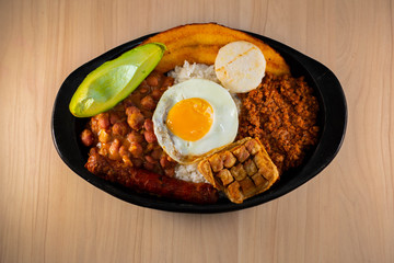 Try paisa, colombian typical food on wood background