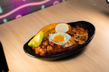 Try paisa, colombian typical food on wood background