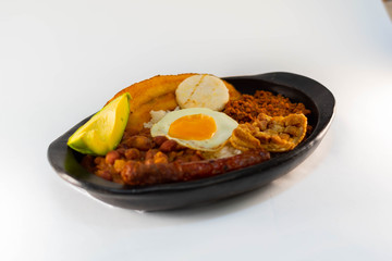 Colombian typical food, try paisa, chopper view on white background