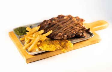 grill Beaf steack on wooden tray, white background