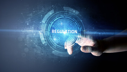 Hand touching REGULATION button, modern business technology concept
