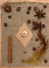 handmade postcard on brown paper and burlap with coffee cardamom vanilla close-up