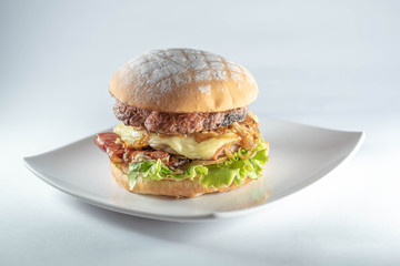 burger with handmade bread on white background