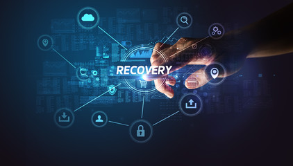 Hand touching RECOVERY inscription, Cybersecurity concept