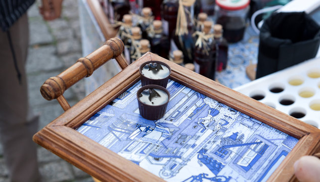 Ginja liquor served on a typical Portuguese ceramic tray