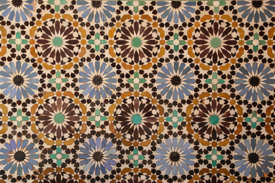 Flower mosaics in yellow blue and brown tile