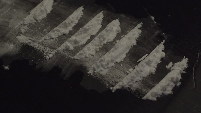 Lines of coke lying on table - dolly