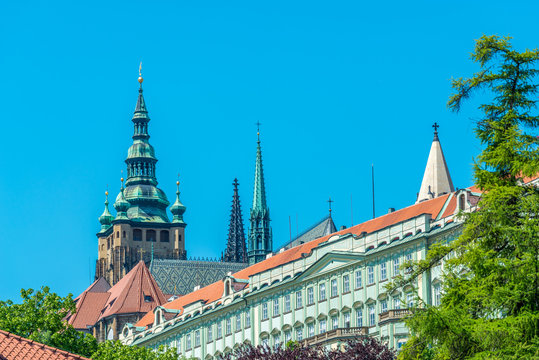 View of the top of old buildings with red roof and blue sky at Prague city Czech republic. © karamysh
