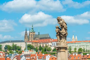 Top view to red roofs and blue sky skyline of Prague city Czech republic.