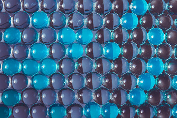 Gel balls. Macro of blue hydrogel background. Abstract wallpaper of  bright 3d round pattern. Copy...