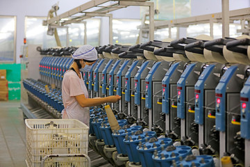 Women spinners are busy on the production line, Luannan County, Hebei Province, China