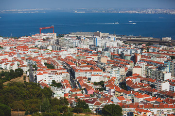 Fototapeta premium Panoramic view of Almada city and municipality, seen from the Sanctuary of Christ the King, Lisbon, Greater Lisbon, Portugal, summer sunny view