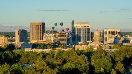 Hot air balloons beginning to take off over the Boise Skyline