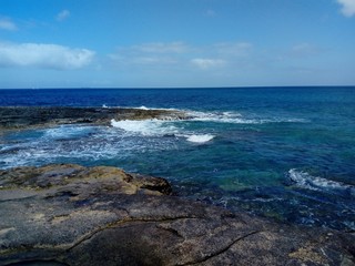 waves of the Mediterranean sea breaking from the shore