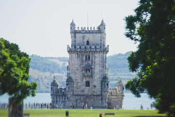 Obraz premium View of Belem district, civil parish of the municipality of Lisbon, Portugal, with Belem Tower, Torre de Belem in Portuguese, a prominent example of the Portuguese Manueline style