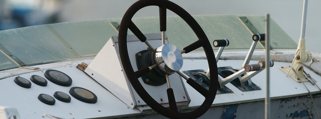 Remote control yacht. Steering wheel, handles, windshield. Lifestyles concepts and touristic travel...
