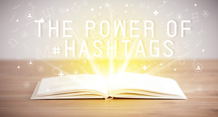Open book with THE POWER OF #HASHTAGS inscription, social media concept