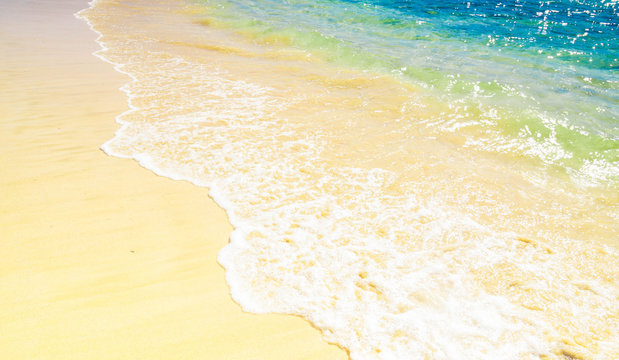 atlantic ocean water waves on beautiful sandy beach in summer, with vibrant colors - vacation background © szmuli