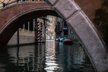 Fototapeta na wymiar canal leads to Canale Grande with boats moored in Venice