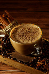 Cup of coffe Cappuccino  with milk on a dark background. Hot coffe ,latte or Cappuccino prepared with milk on a wooden table with copy space