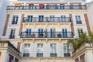 Fototapeta na wymiar Paris, typical facade and windows, beautiful building in Montmartre