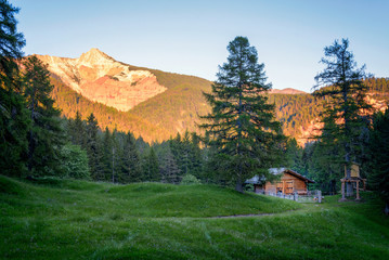 mountain hut with the Wei&szlig;horn mountain(Corno Bianco), occasionally also Aldeiner Wei&szlig;horn mountain in the background, golden hour , Alto Adige, ITALY