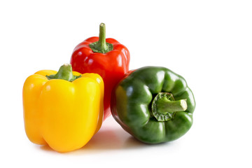 Red, yellow and green bell pepper isolated on white background