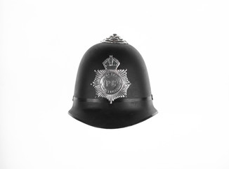 traditional british bobby police helmet isolated on white background