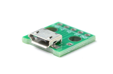 Micro USB female connector module, isolated on white background.