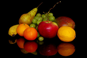 Diferent fruit on a black background