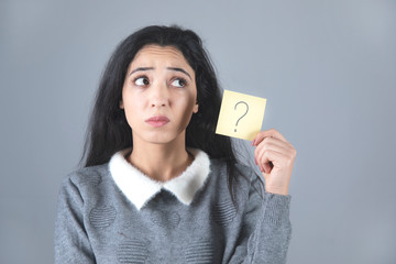 sad woman hand question mark on paper