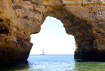 Natural stone arch of the Albandeira beach in Lagoa, Algarve region, Portugal
