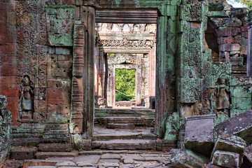 Fototapeta na wymiar Preah Khan Temple site among the ancient ruins of Angkor Wat Hindu temple complex in Cambodia