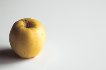 Yellow apples on a white background, wholesome food, farming, vegetarian