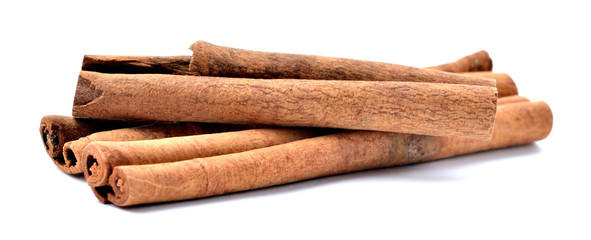 Cinnamon sticks seasoning isolated on white background. Close-up.