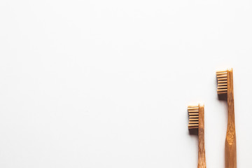 Wooden bamboo toothbrushes on white background isolated. The concept of zero waste, recycling