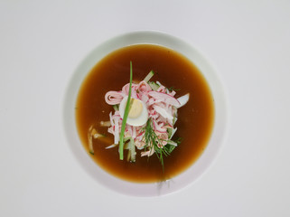 Okroshka made of kvass in a white plate. Russian cold soup. View from above.