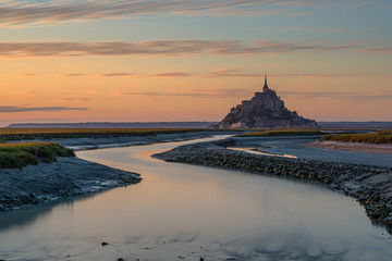 Mont-Saint-Michel is the name of a tidal island located off the coasts of Normandy and Brittany, near the mouths of the Couesnon